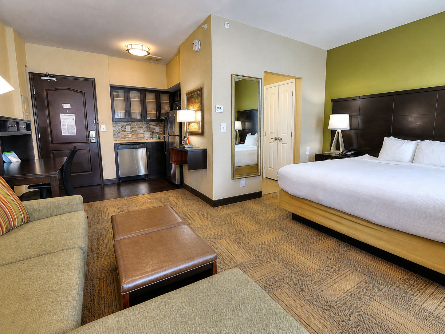 image Accessible king studio suite with comfortable bed and open layout.