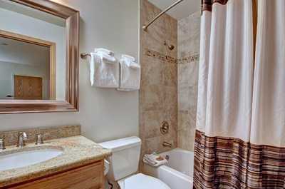 Get ready for the day in the bright and modern bathroom.