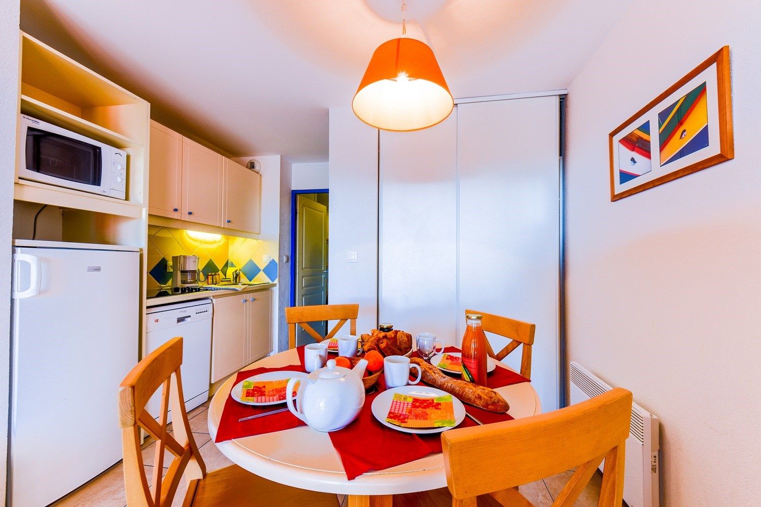 image Settle into the dining area and enjoy a nice meal.