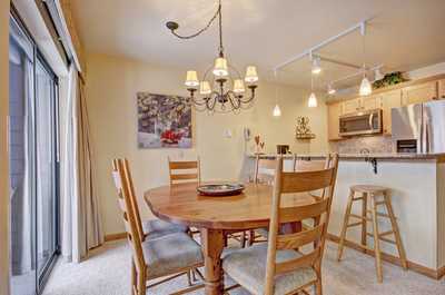 Enjoy meals together at the dining table or breakfast bar in the kitchen.