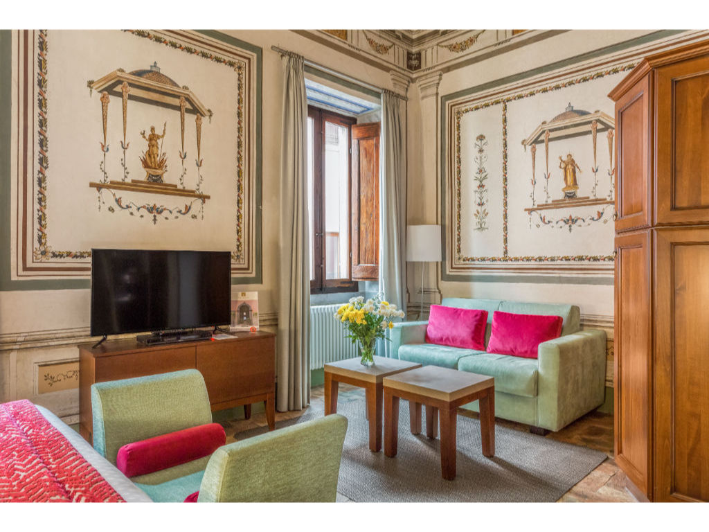 image A living room that combines antique charm with pops of color for a vibrant yet classic feel.