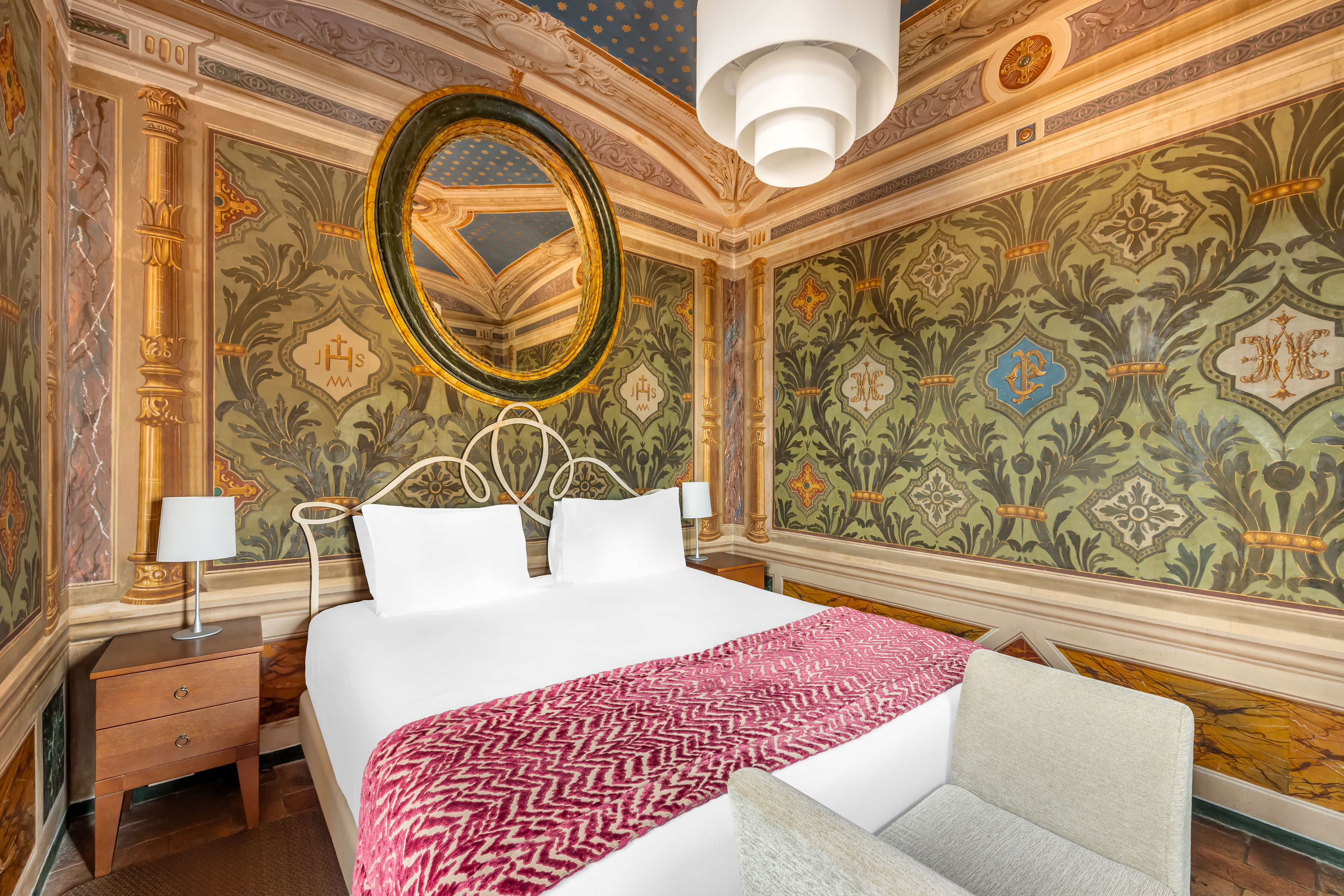 image Wake up under a frescoed ceiling in a bedroom that marries historic artistry with contemporary comfort.