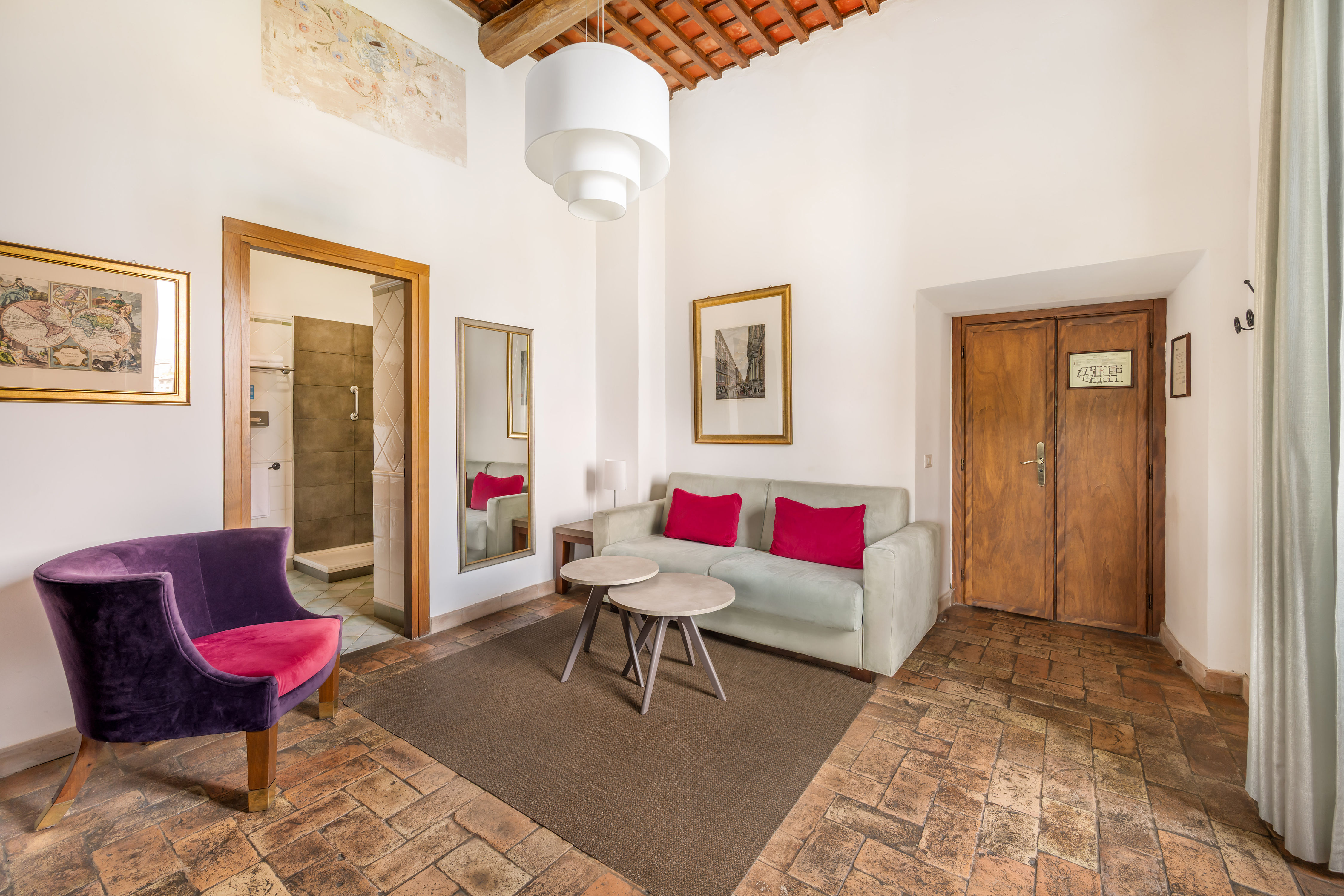 image Bright, inviting living space with pops of color that add a playful touch to the classic backdrop.