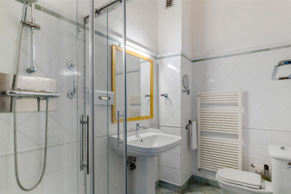 image A practical bathroom outfitted to support accessibility, providing a safe and comfortable experience.