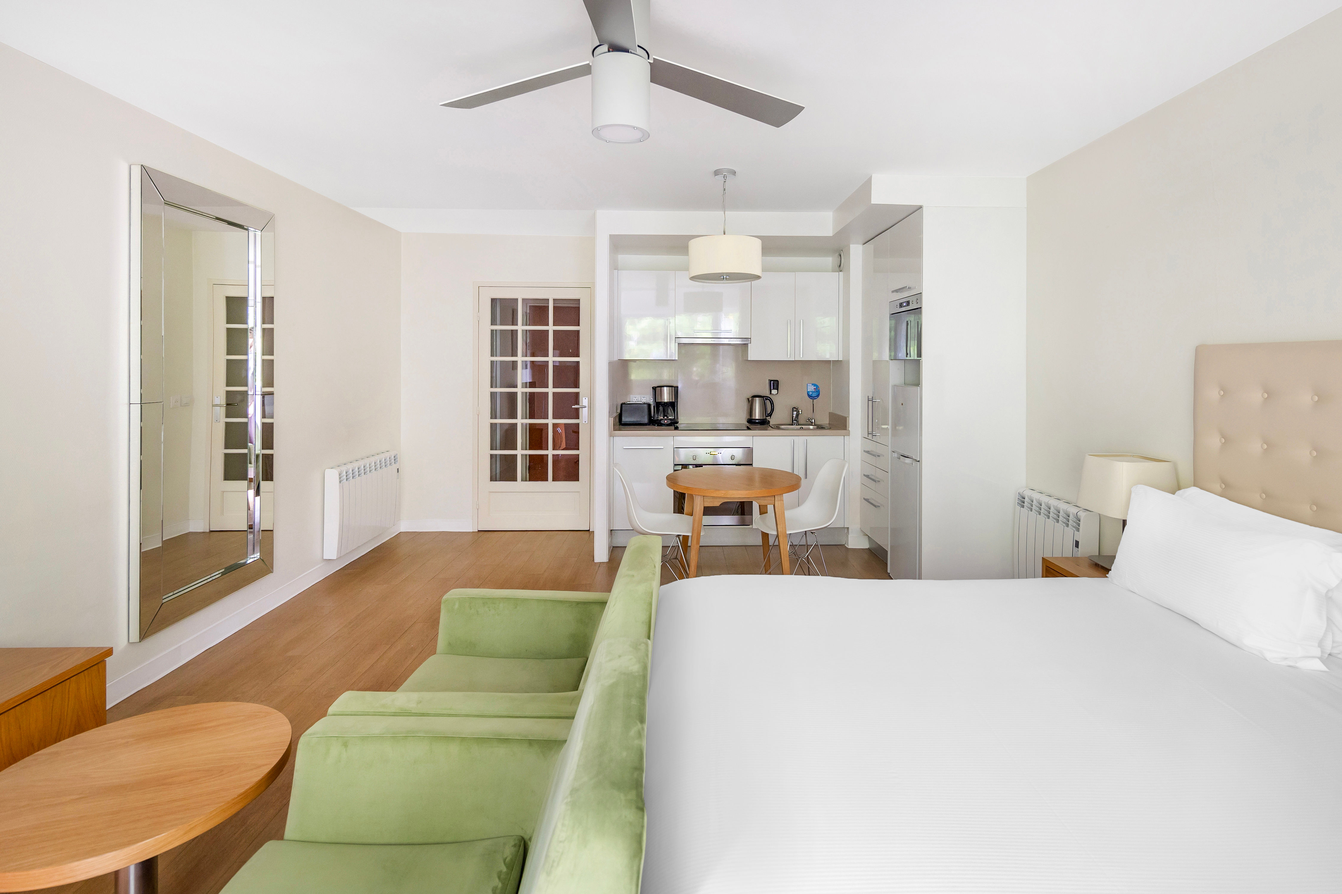 image An angle of the apartment showing a well equipped kitchen complete with modern appliances, ideal for preparing meals or enjoying a morning coffee.