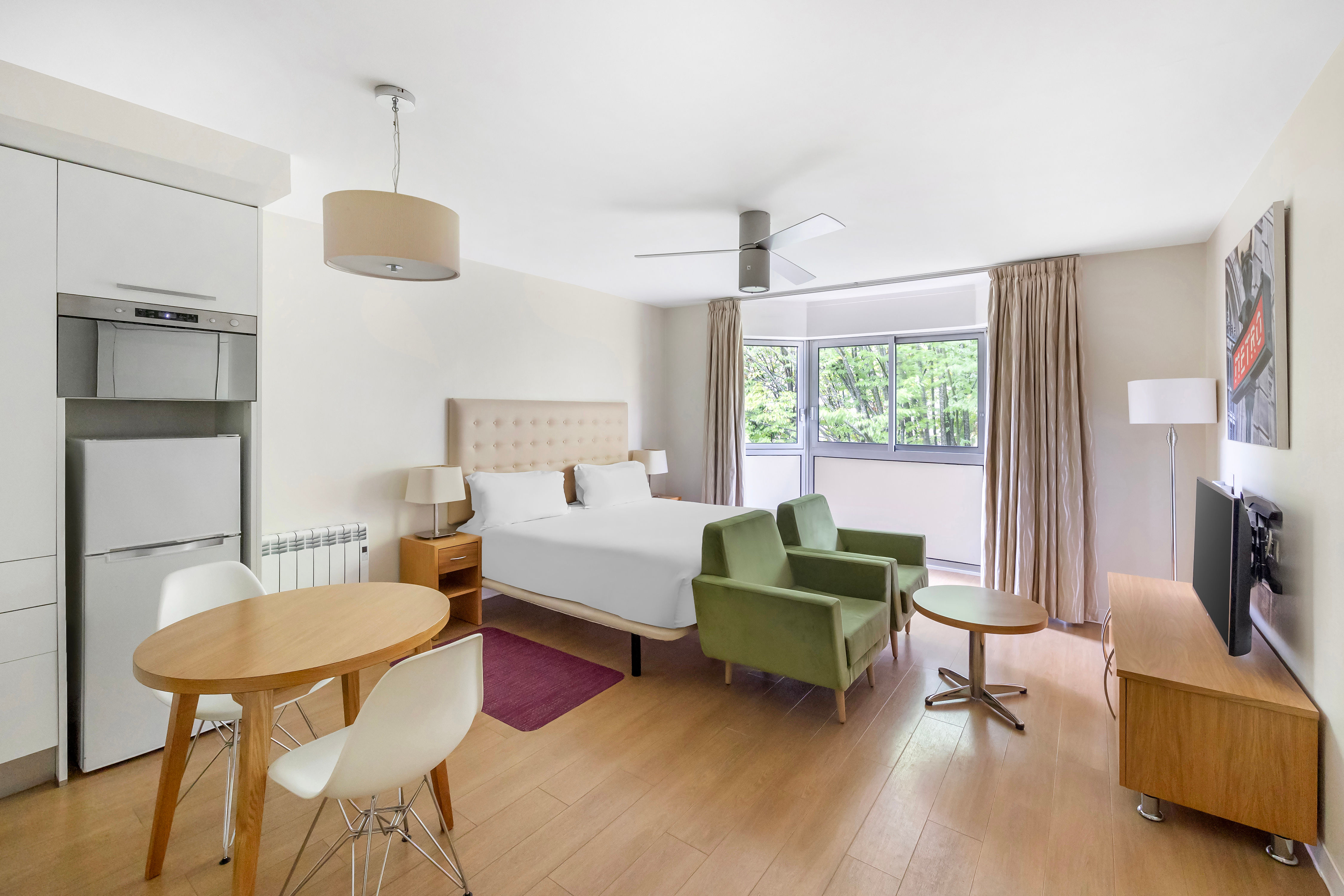 image A cosy studio featuring a plush double bed, perfect for relaxing after a day exploring Paris.