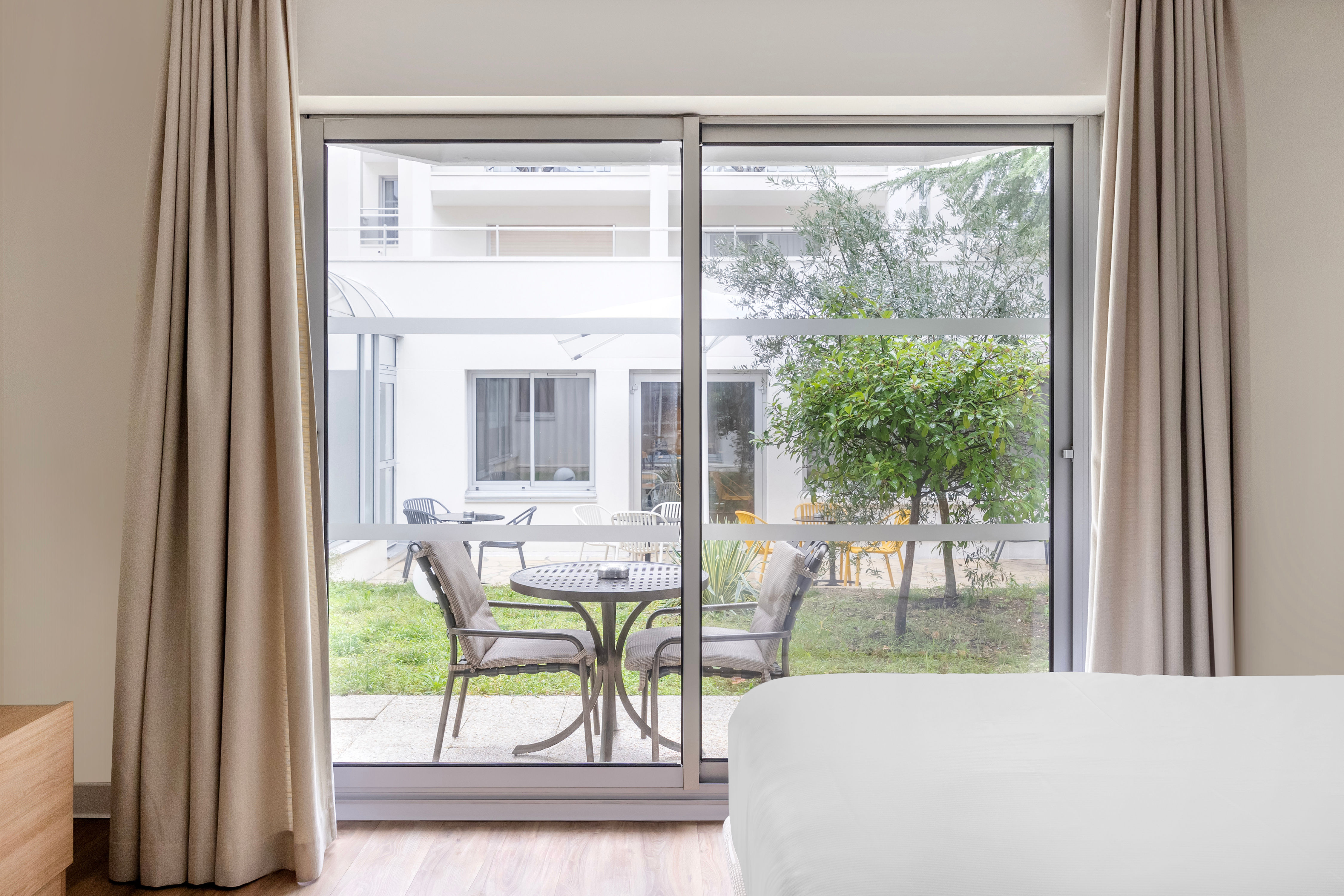 image Enjoy a serene view from your private balcony, perfect for sipping coffee and unwinding.