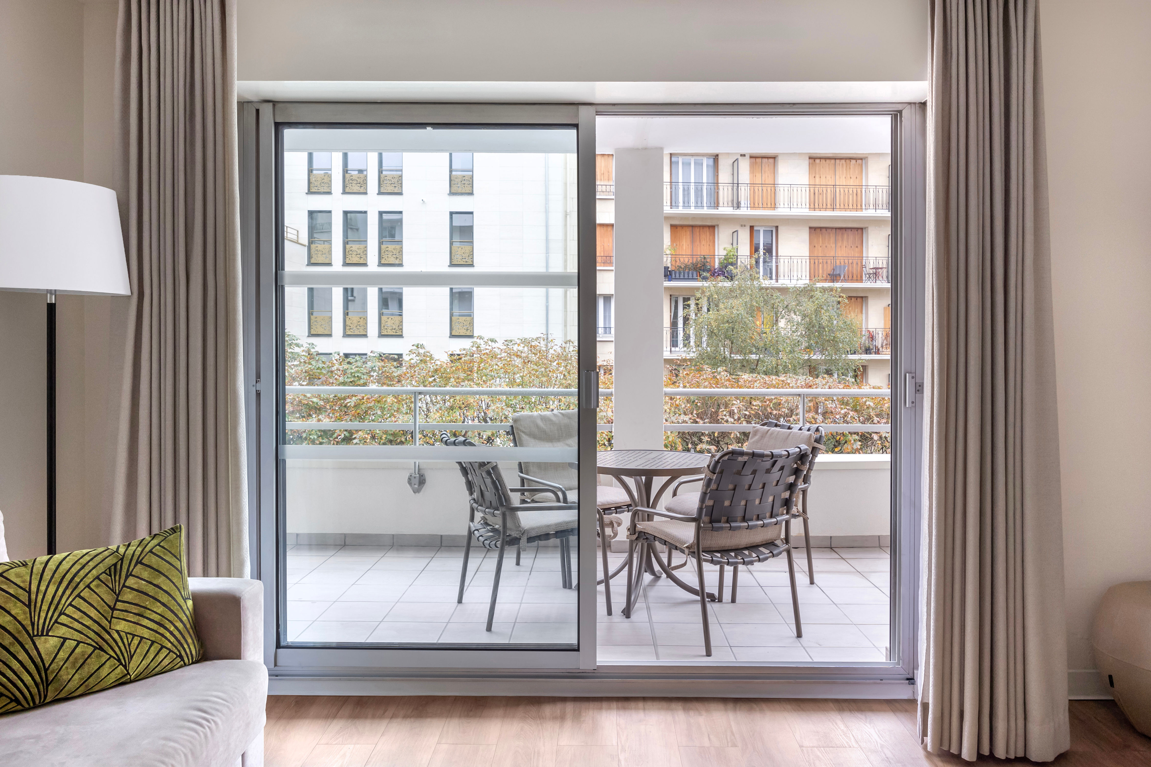 image Enjoy fresh air and serene views from your private balcony, complete with outdoor seating for quiet mornings or evenings.