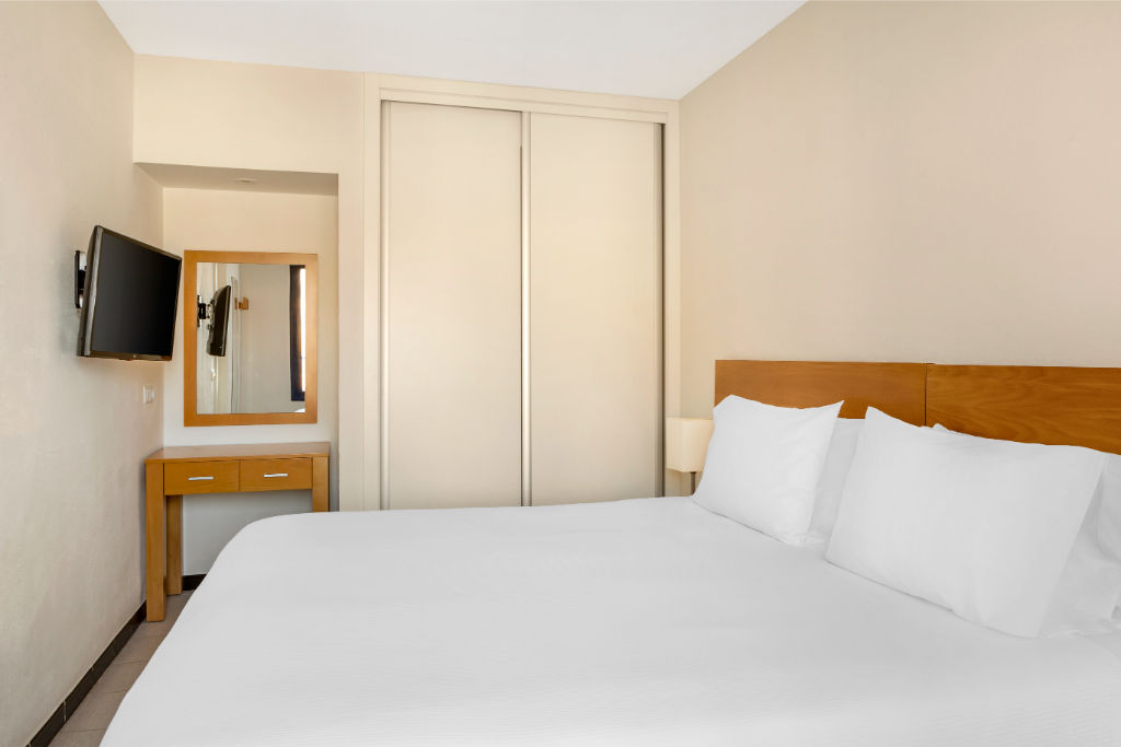 image Retreat to our restful bedroom.