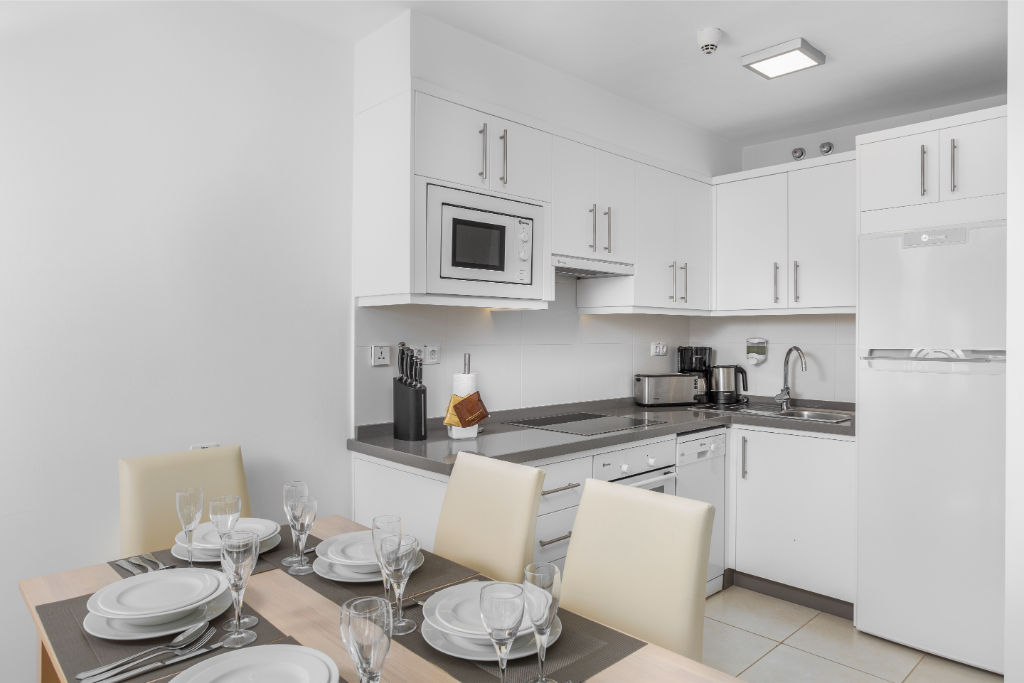 image Dine in elegance in our minimalist kitchen and dining area.