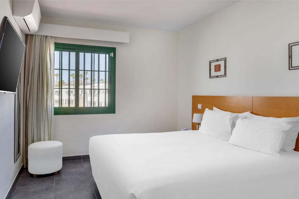 image Cozy bedroom retreat with crisp linens and tranquil decor to ensure a peaceful slumber.