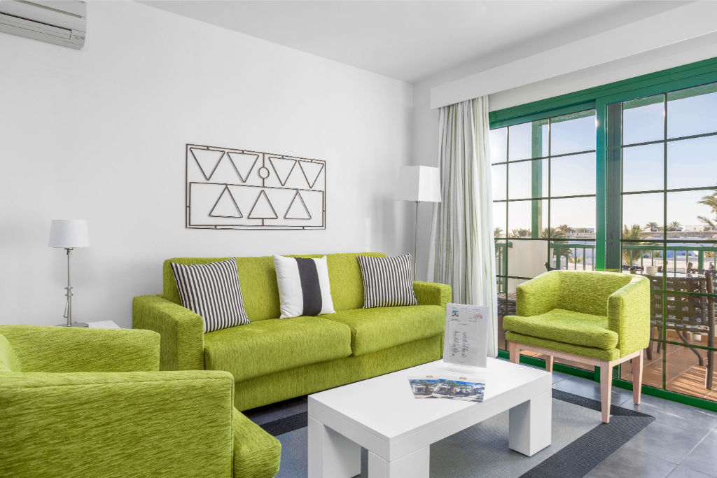 image Lounge in a vibrant living area, perfect for relaxation or catching up on your favorite book.