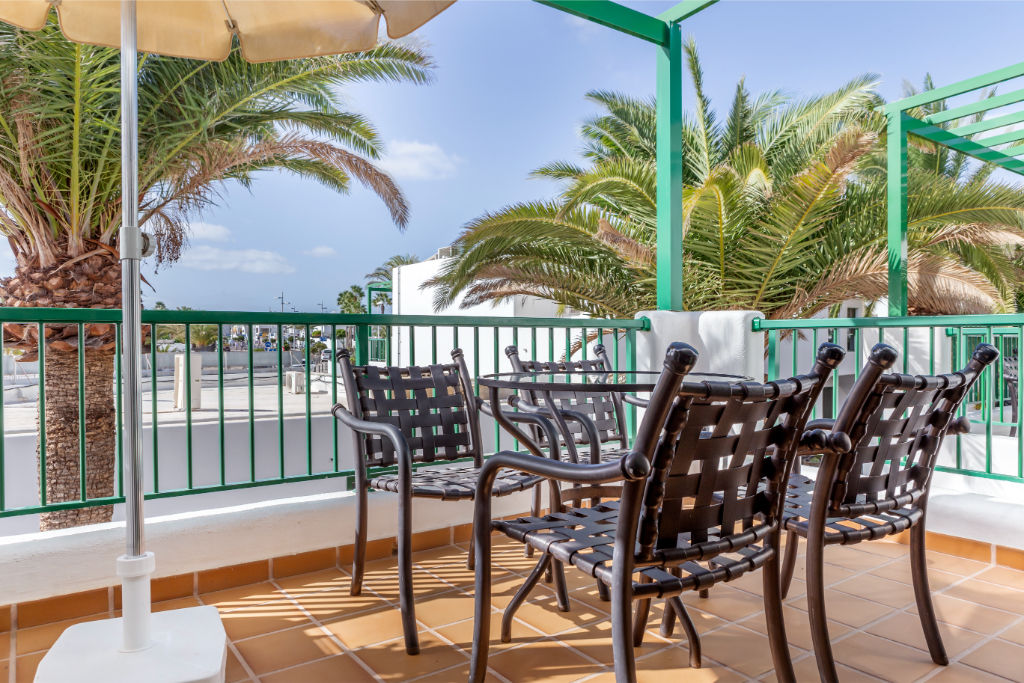 image Savor your morning coffee on a balcony with breathtaking views and a gentle breeze.