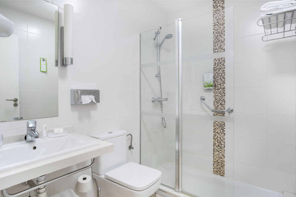 image Contemporary bathroom with a spacious shower, designed for a refreshing experience.