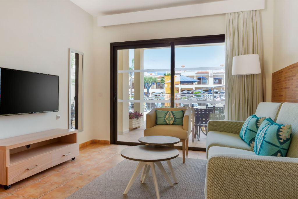 image Cozy living room with balcony access, offering a comfortable space