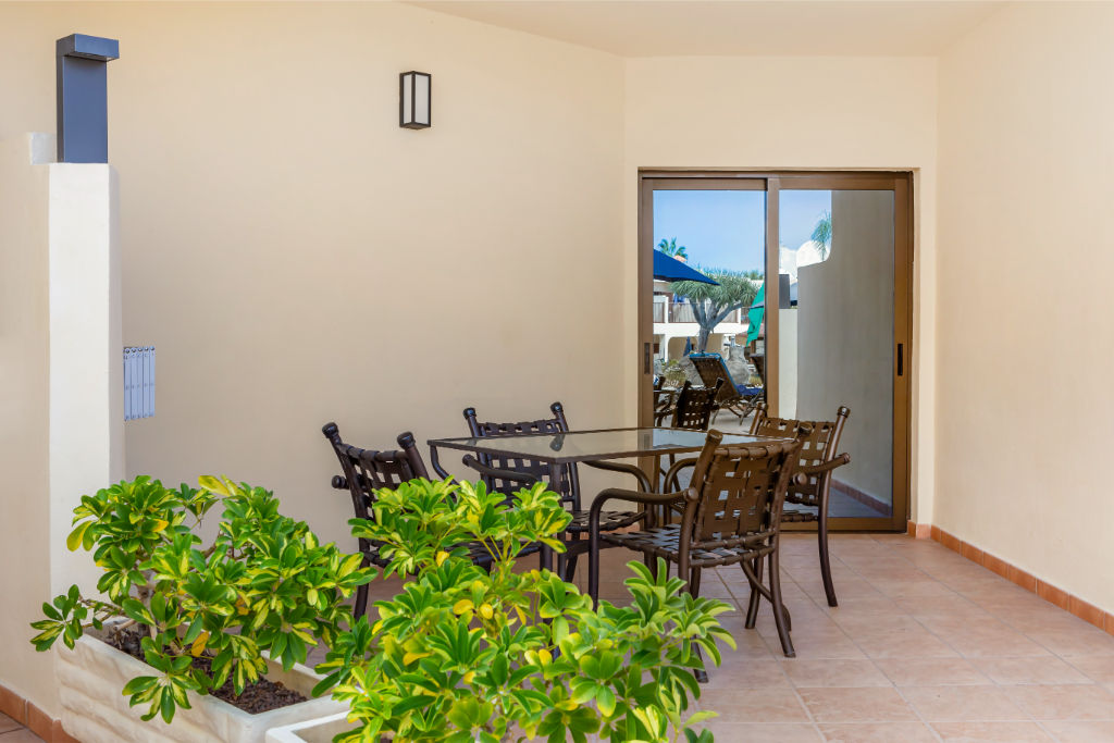 image Sunlit living room opening onto a welcoming balcony, perfect for morning coffees and evening wines.