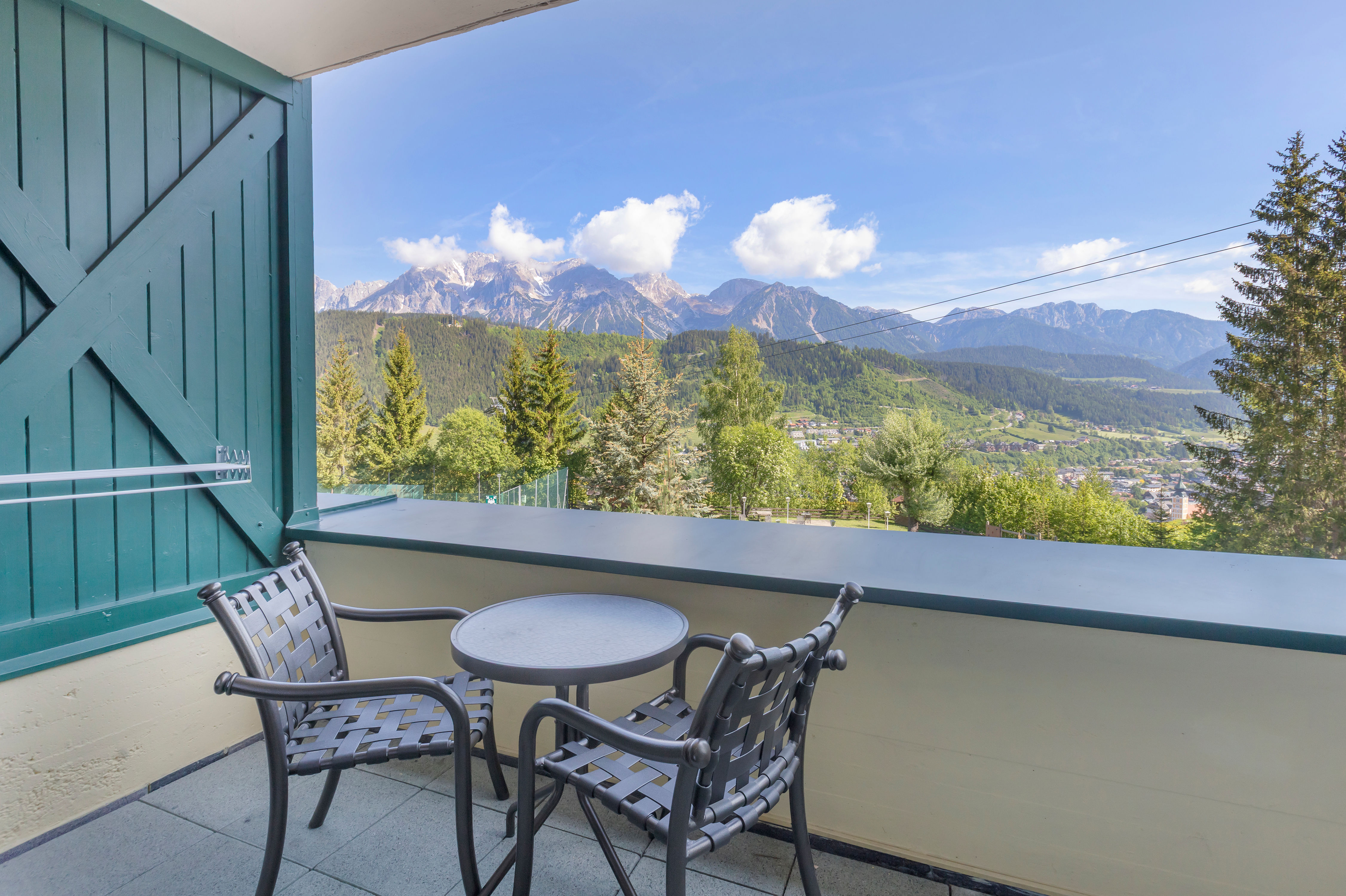 image Enjoy stunning alpine views from your private balcony, a serene spot for morning coffee or après-ski evenings.