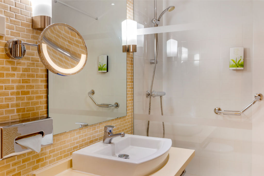 image A bright and airy bathroom with clean lines, providing a neat and refreshing space for daily routines.