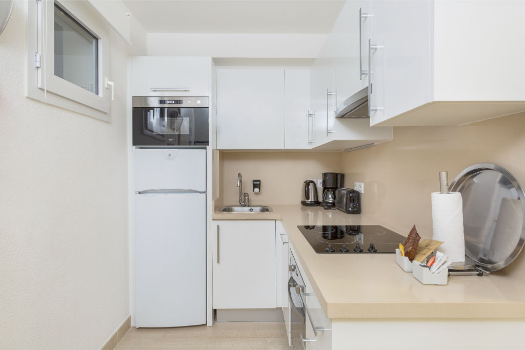 image Streamlined and open kitchen area, perfect for preparing meals with ease.