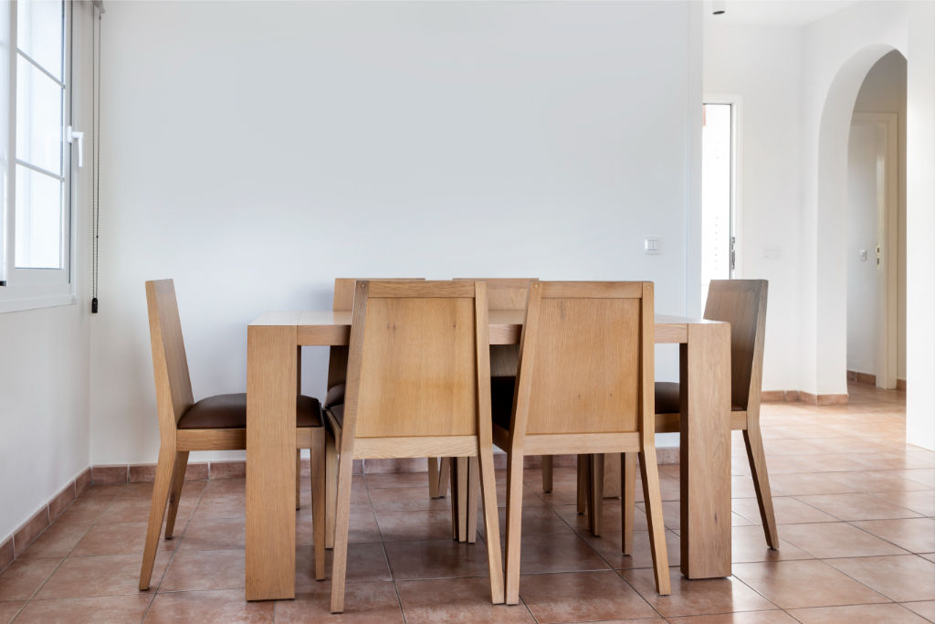 image Gather around this sleek dining table for a family feast or a friendly get-together.