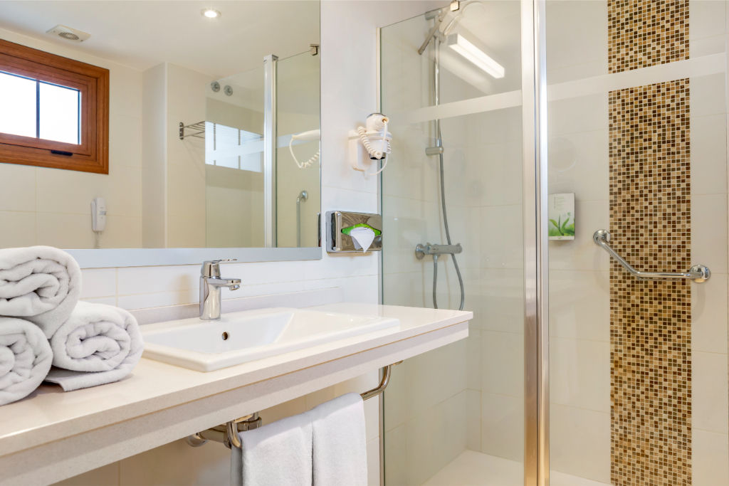 image Bright bathroom with a spacious shower and clean, modern design.