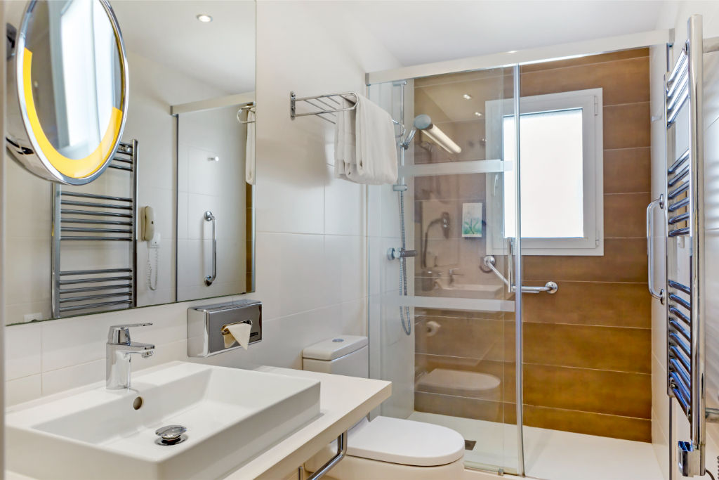 image Contemporary bathroom with a spacious shower and sleek design.