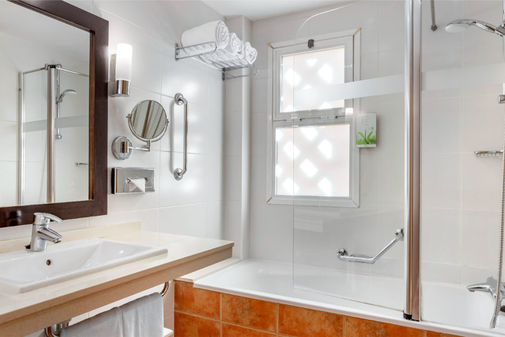 image Functional bathroom with necessary fixtures for daily routines.