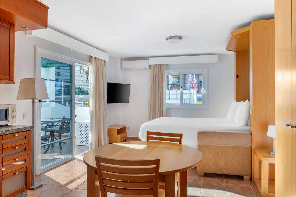 image Combined living and dining space with natural light for a comfortable stay.