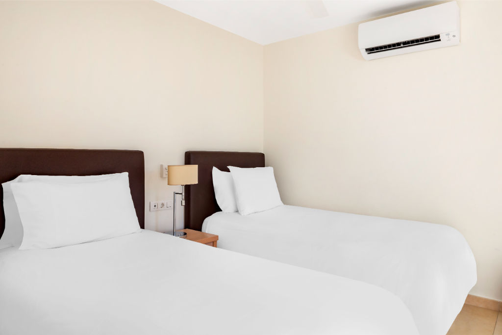 image Welcoming bedroom with soft lighting and a homely atmosphere for your rest.