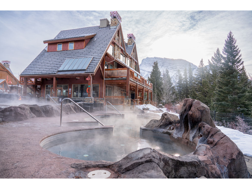 image Relax in a steaming outdoor soak, embraced by the tranquility of the mountains and the crisp winter air.