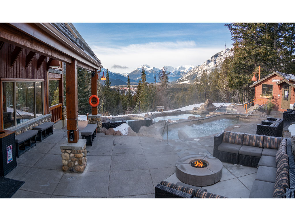 image Cozy up by the fire or take a refreshing soak while admiring panoramic mountain views in this peaceful alpine retreat.