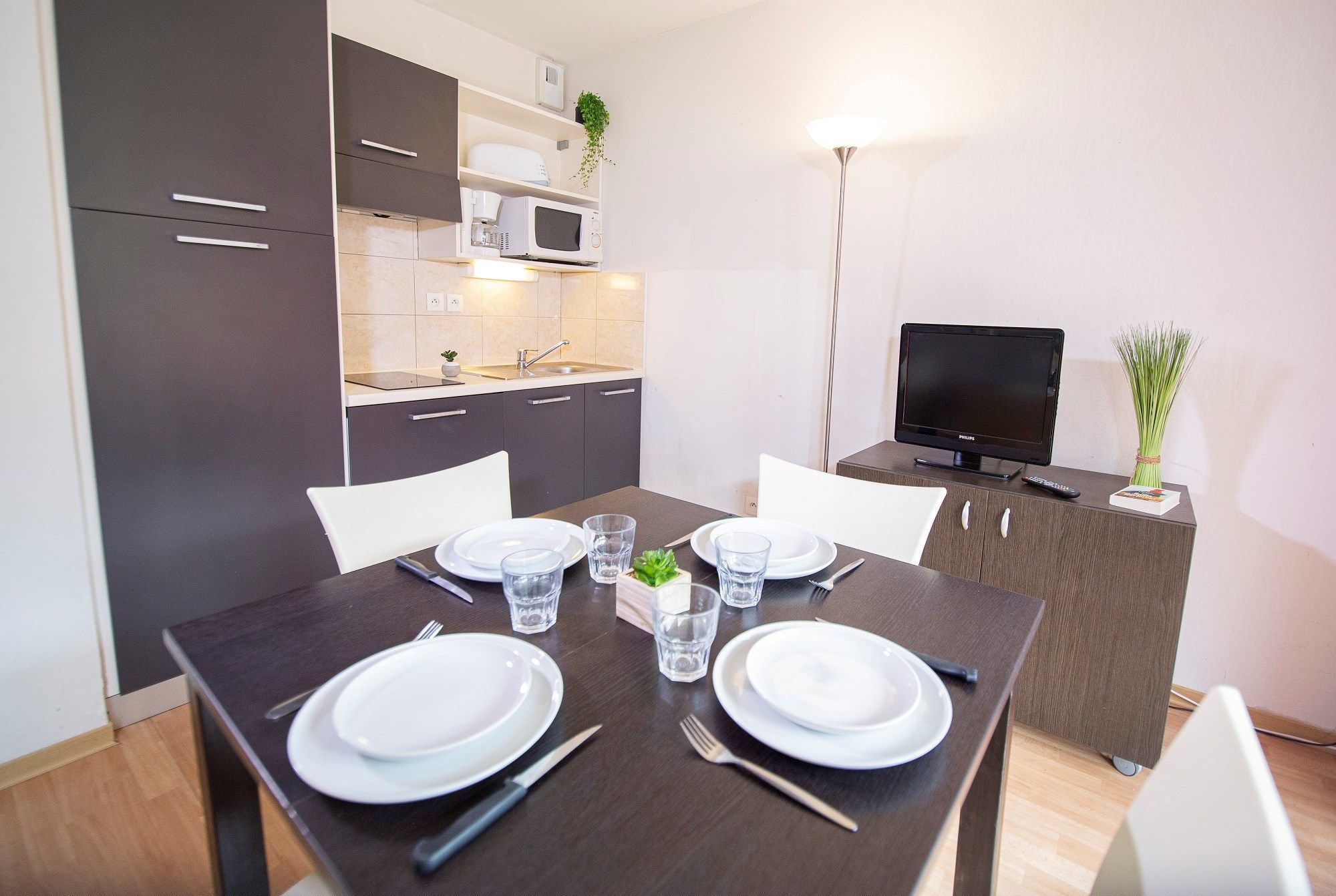 image Share meals and laughs at the dining table. Please note that the TV is available for an additional charge.