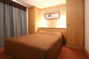 image Drift to sleep in a comfortable bed after a wonderful day outside.