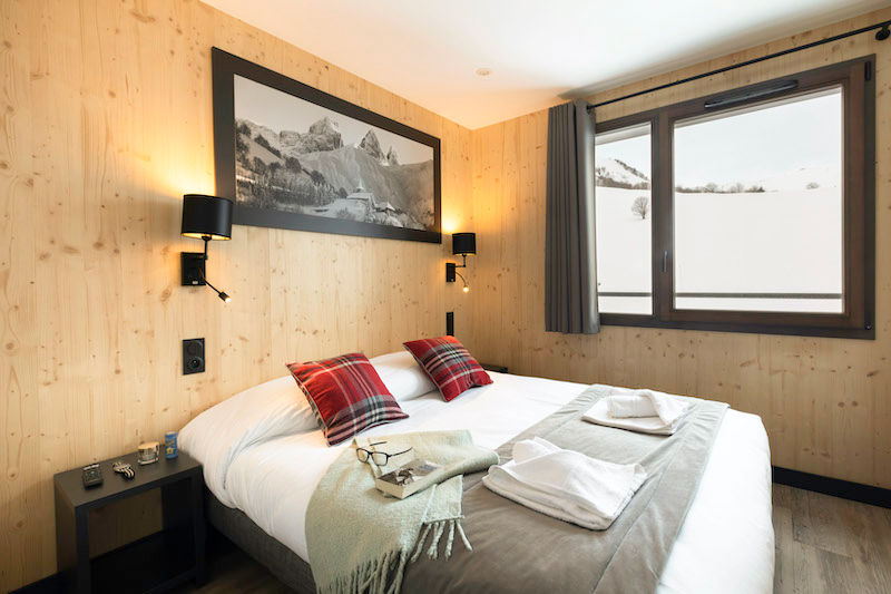 image Drift to sleep in a comfortable bed after a wonderful day outside.