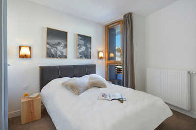 Relax on the comfy bed after a day outside.