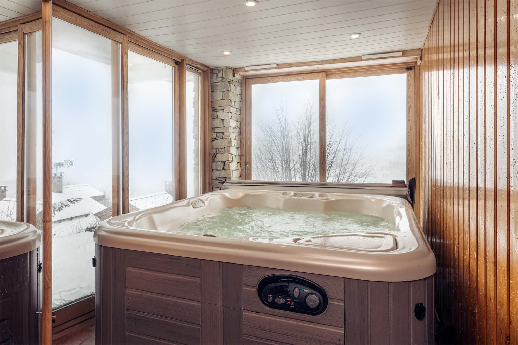 image Take a dip in the private indoor hot tub surrounded by large glass windows