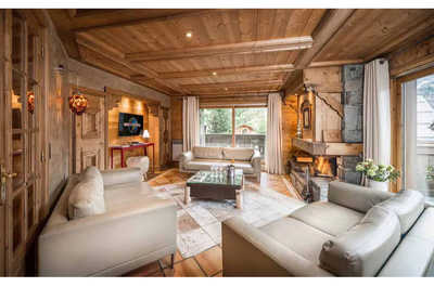 Relax in the comfy living area and warm-up by the fireplace after a day outside.