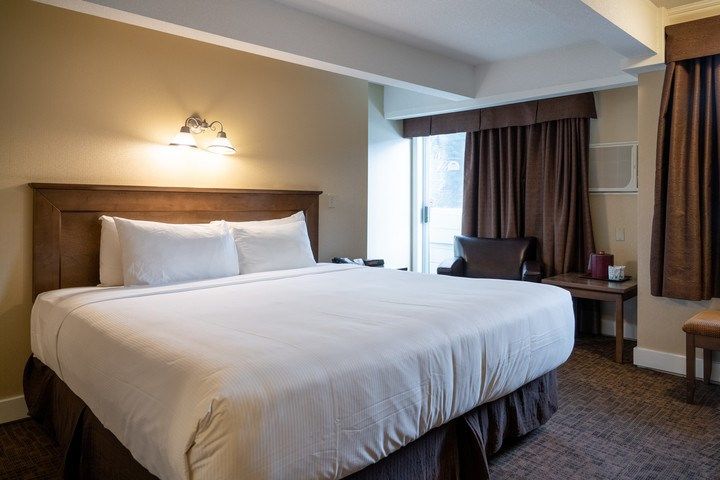 image Drift to sleep in a comfortable bed after a wonderful day outside.