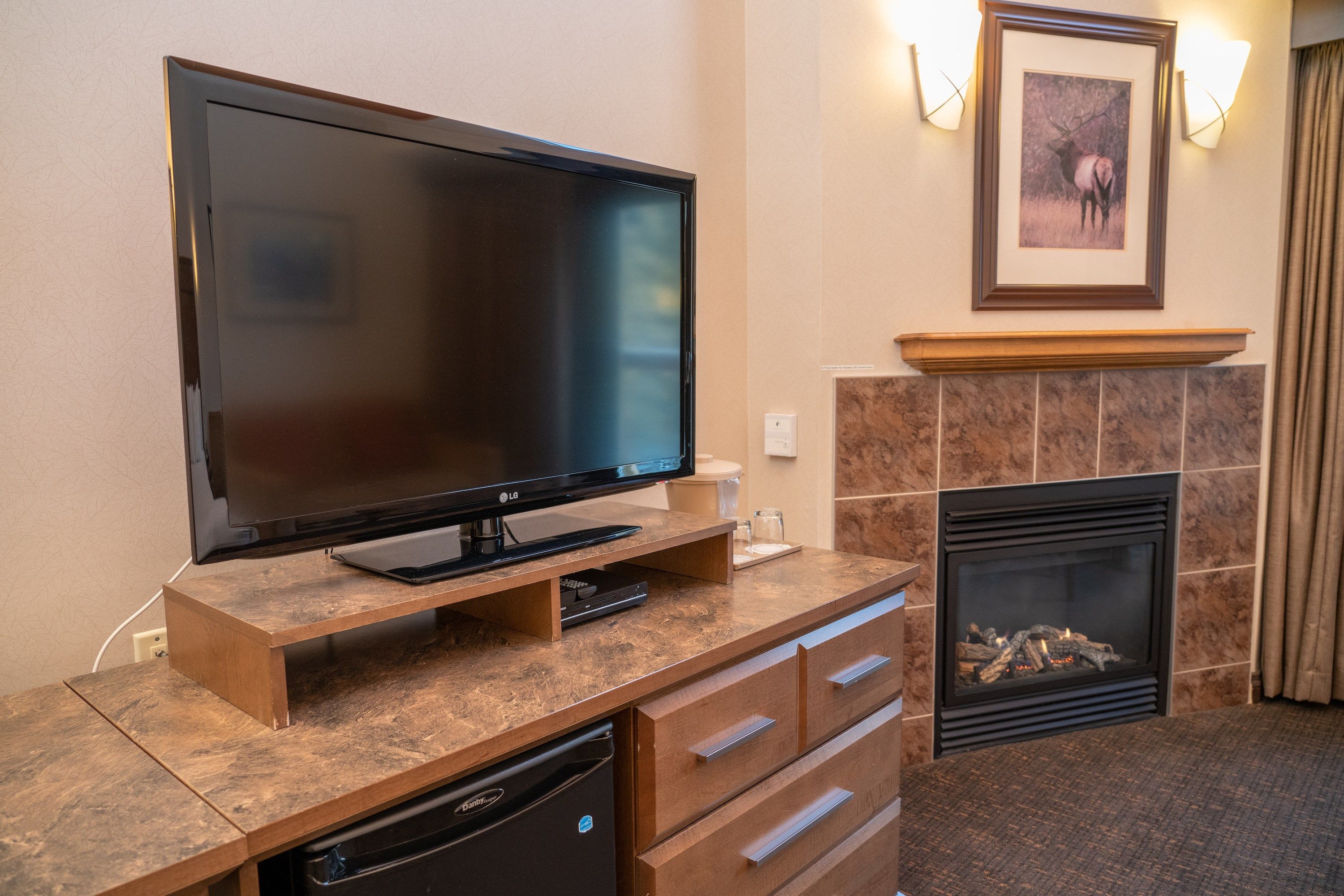 image Watch your favourite show on the TV while warming up by the gas fireplace.