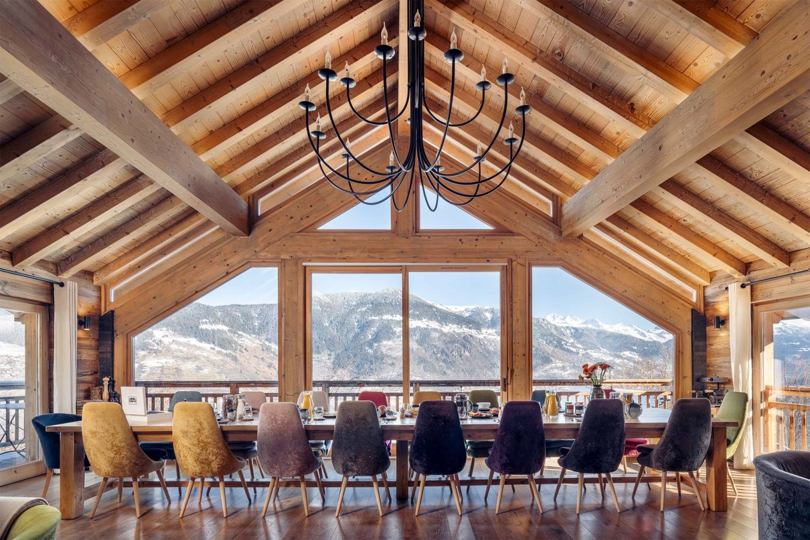 image Dining area with mountain views through the windows — a room with a view