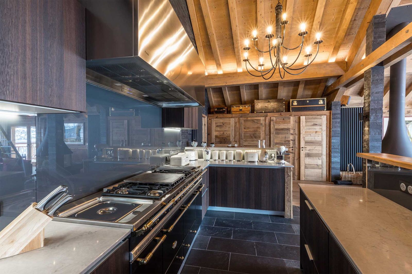 image Warm wood accents give the kitchen a refined alpine feel