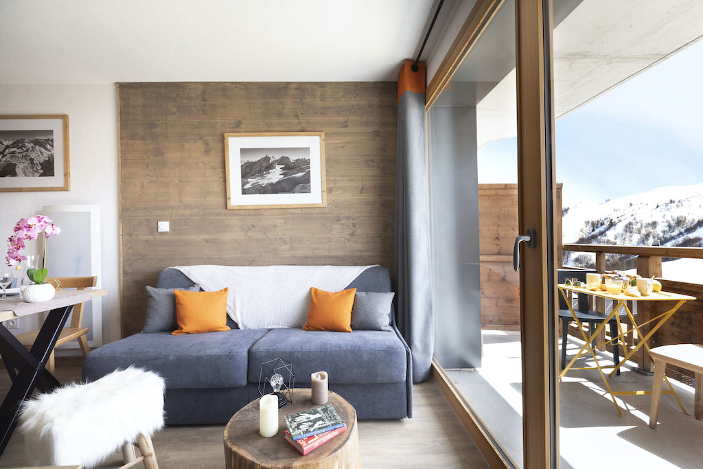 image Relax in the comfortable living area. Some apartments may feature a balcony or terrace.