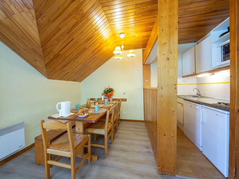 image Settle into the dining area and enjoy a nice meal.