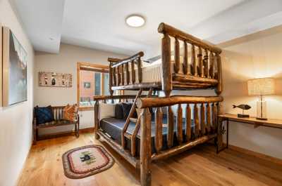 The third bedroom features a queen bed over a king bed. 