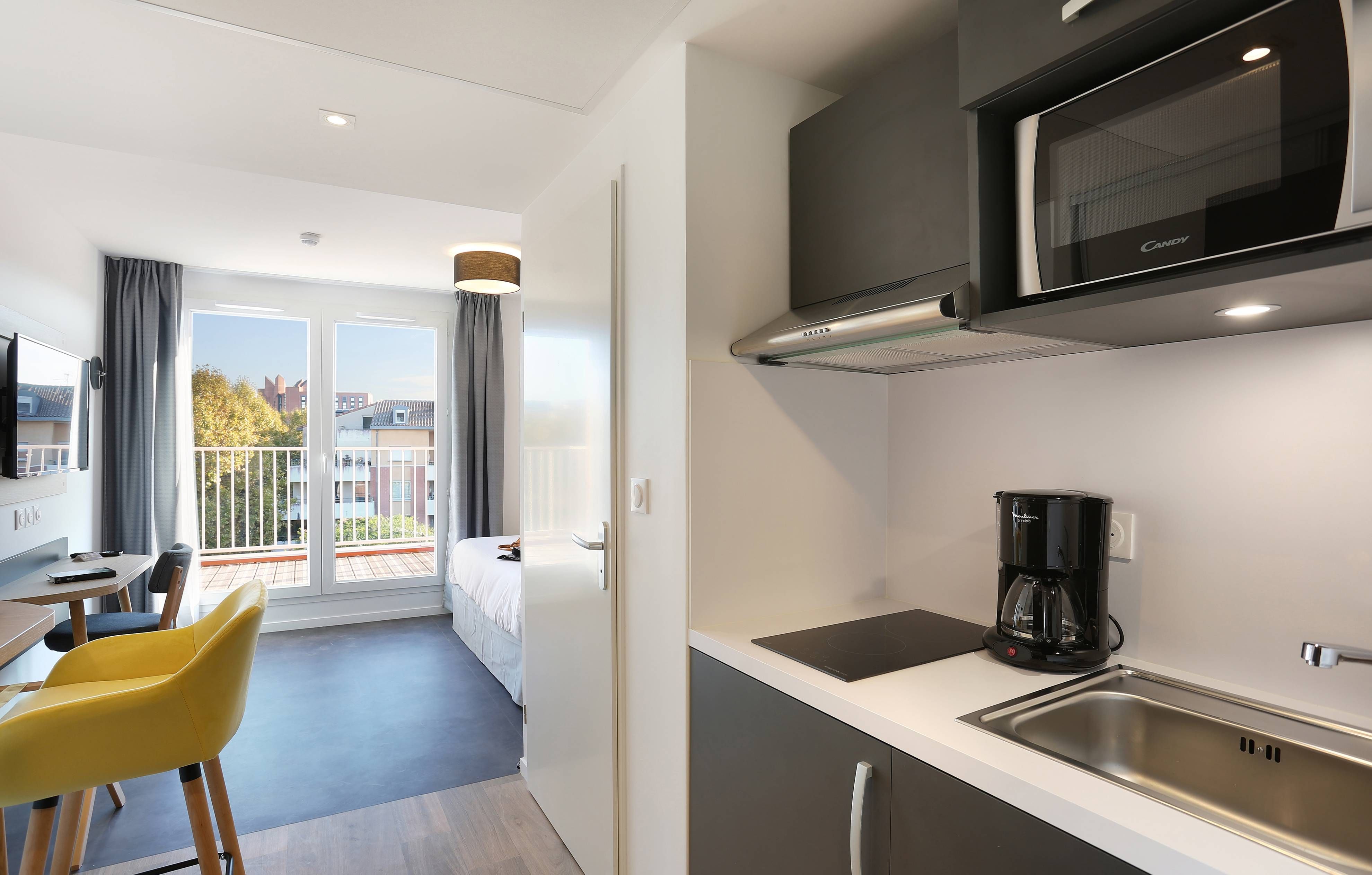 image Whip up a quick bite to eat in the kitchen. Please note that we cannot guarantee that your unit will come with a balcony.
