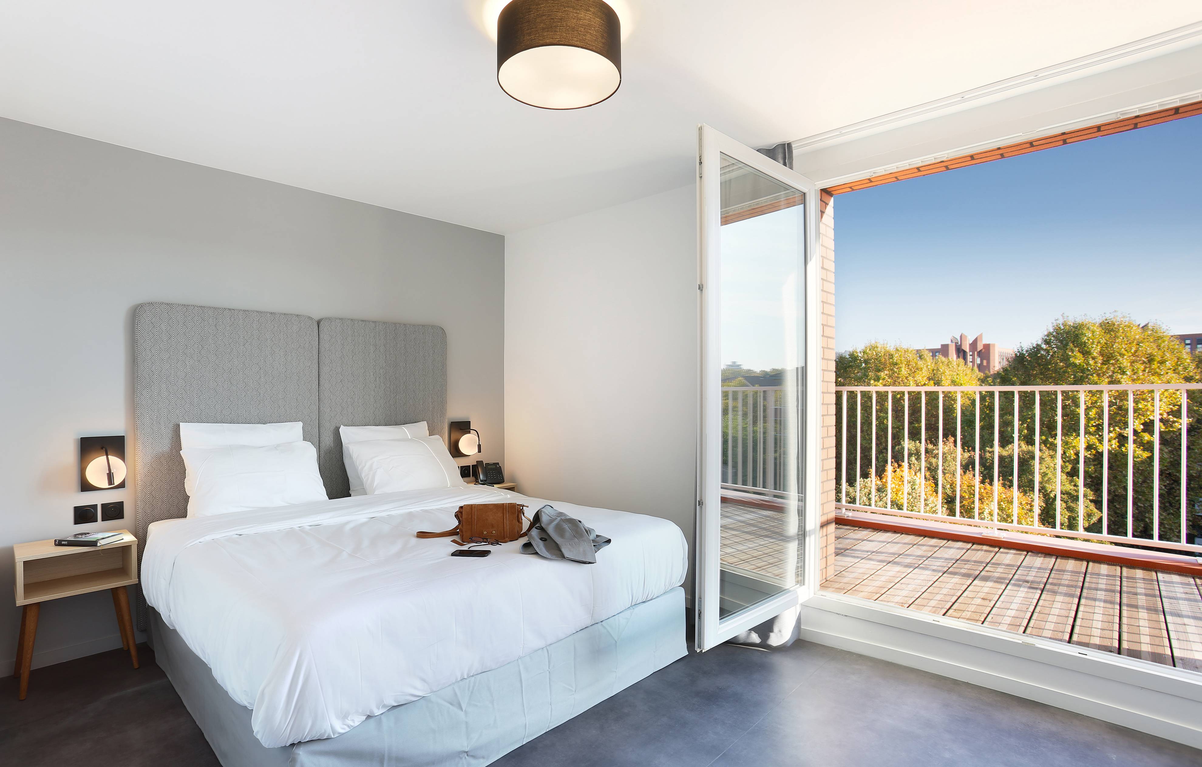 image Drift to sleep in a comfortable bed after a wonderful day outside. Please note that we cannot guarantee that your unit will come with a balcony.
