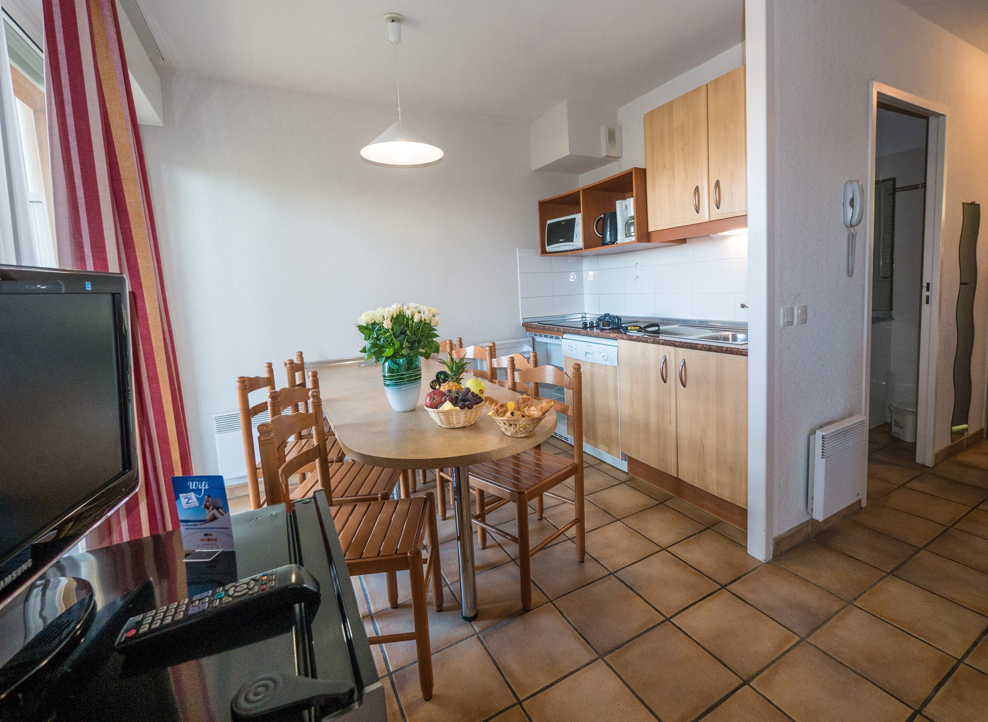 image Whip up a meal in the kitchenette before enjoying it at the dining table.