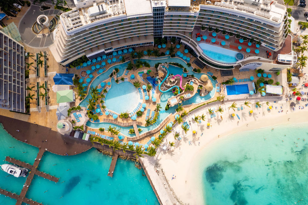 image Discover a bird's-eye view of leisure and luxury at our vibrant resort pool.