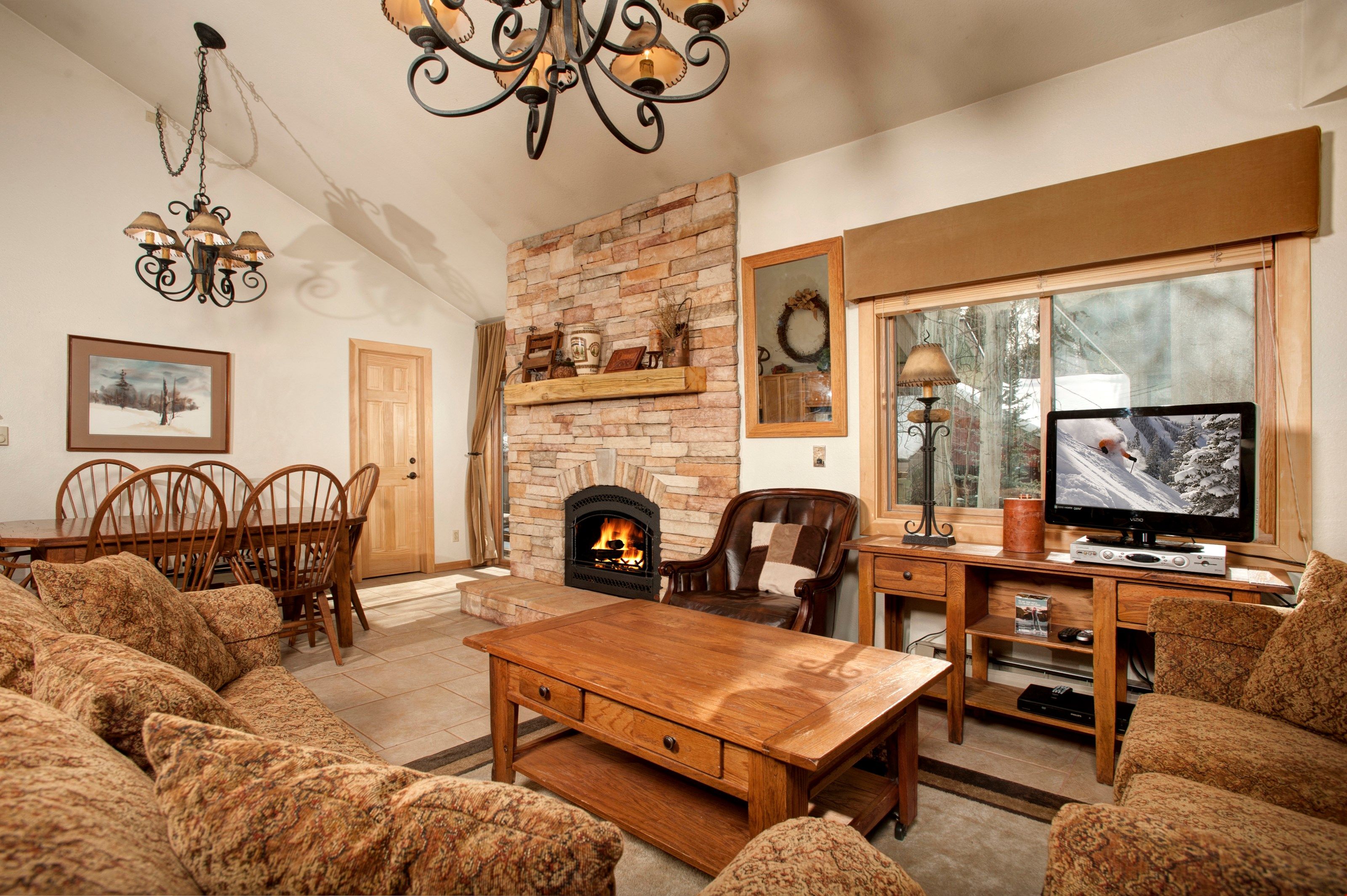 image Take a seat in the comfortable living area, complete with cozy fireplace.