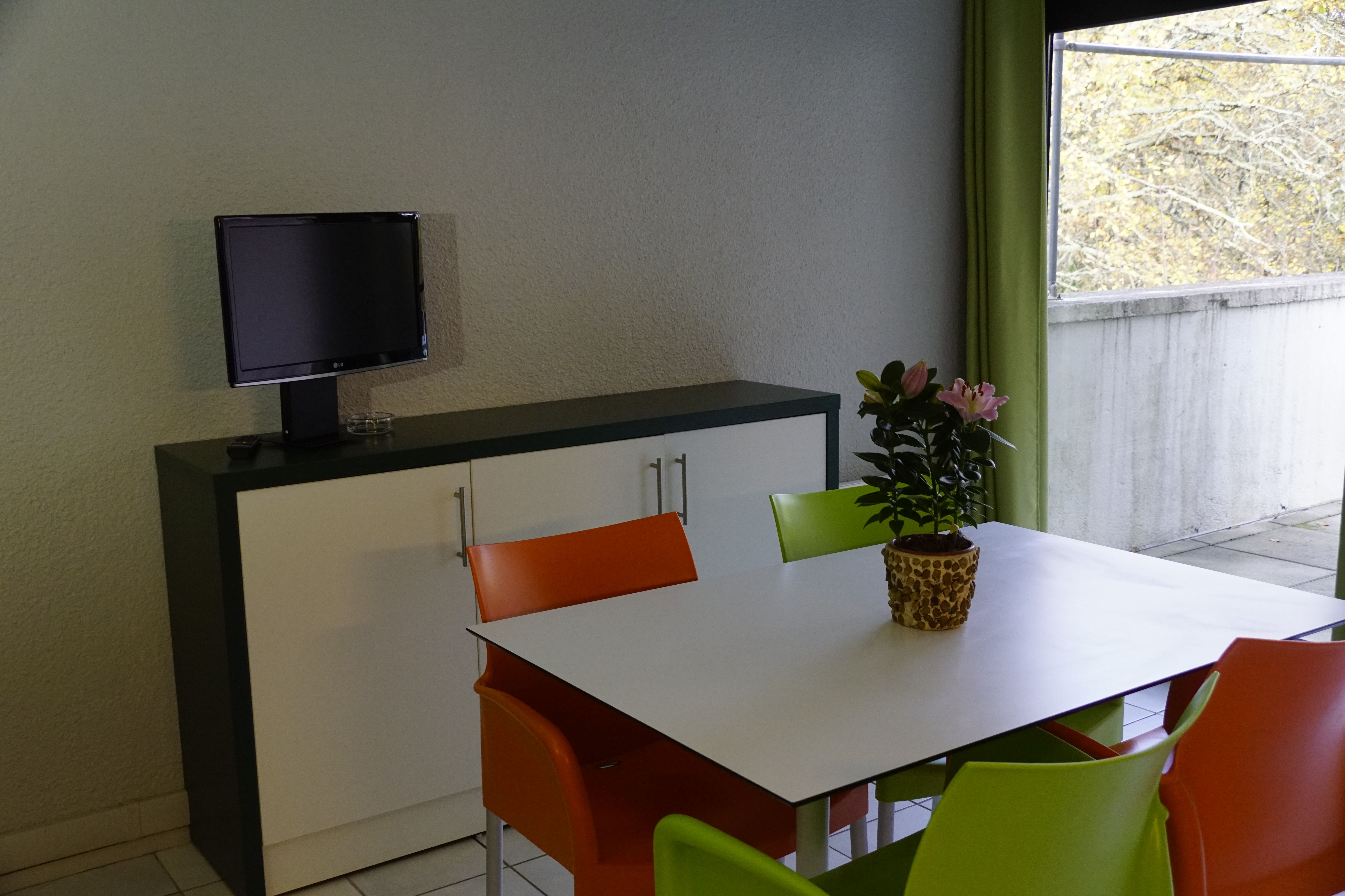image Settle into the dining area and enjoy a nice meal.